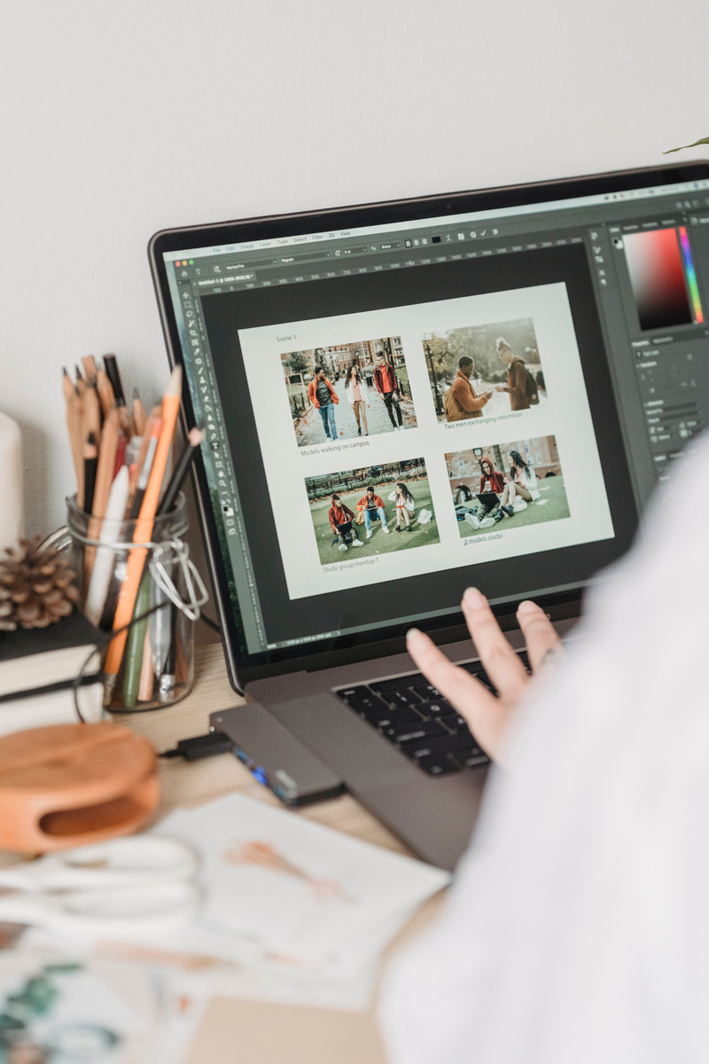 Anonymous woman retouching photos using netbook